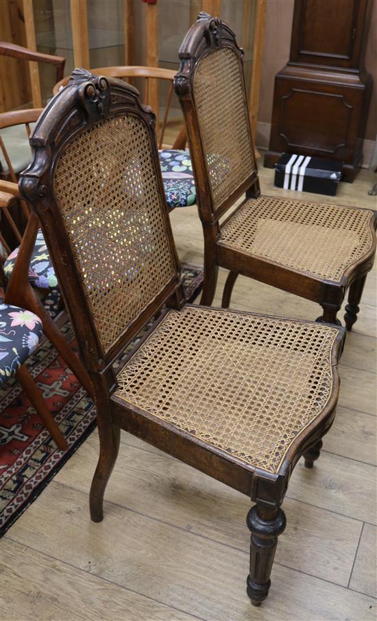 A pair of French beech cane seat chairs